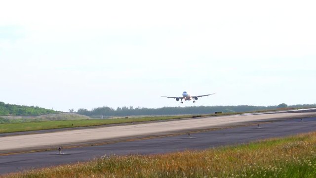 Thailland. Phuket international Airport. Airfield. Slow motion. Plane landing.