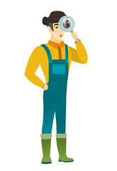Asian farmer with magnifying glass.