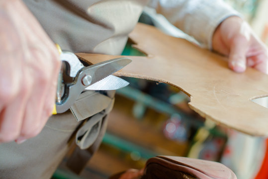 Craftsman cutting a pattern