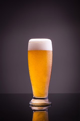 Glass of cold beer on a table