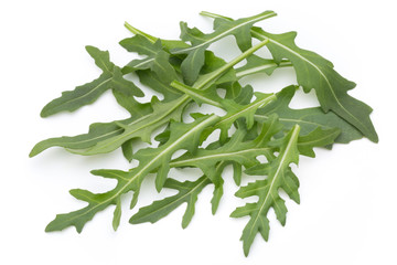 Close up studio shot of green fresh rucola isolated on white bac
