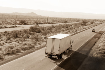 Cross-country traffic on Interstate I-10 through the desert in California
