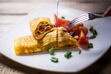 Slicing home made omelet