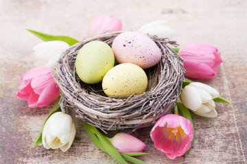 Obraz na płótnie Canvas Easter eggs in the nest. Spring greeting card.