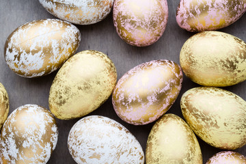 Easter eggs painted in colors on a pattern background.