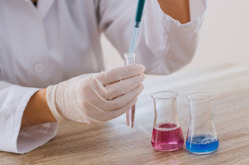 Fototapeta premium Laboratory assistant analyzing a test sample