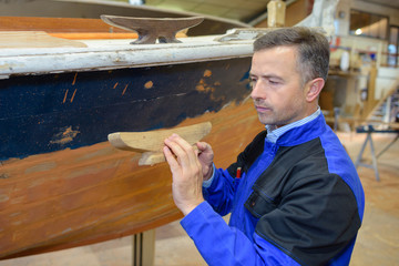 worker making a boat