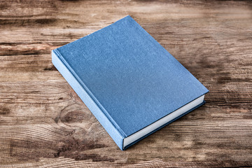 New book on wooden background