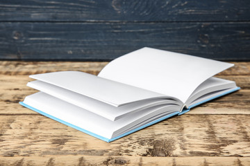 New book on wooden background