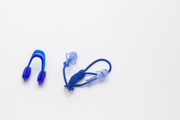 Nose clip and ear plugs for swimming pool on white background