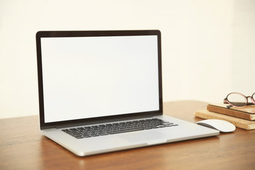 Modern laptop on wooden desk