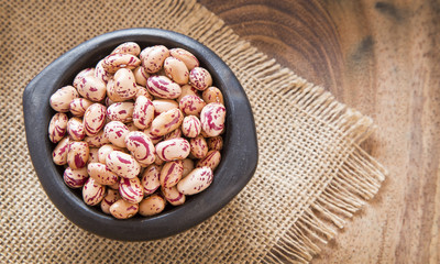 Pinto beans on wooden table