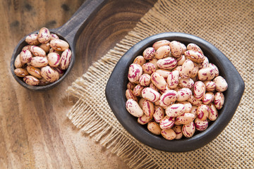 Pinto beans on wooden table