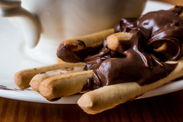 Grissini with Chocolate cream and tea or coffee.