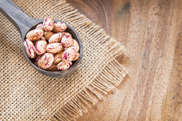 Pinto beans on wooden table