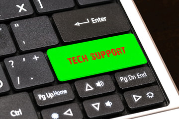 On the laptop keyboard the green button written TECH SUPPORT