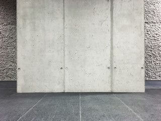 Sunlit interior with blank concrete wall and floor.