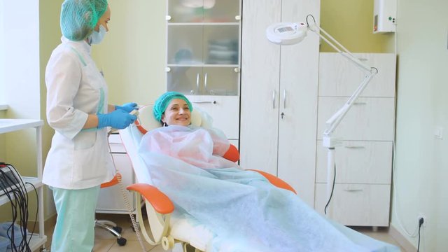 Cosmetology doctor female preparing to make treatment her patient in medical center