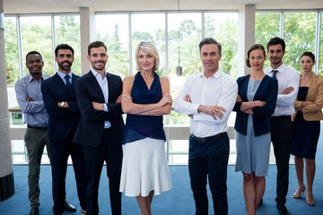 Fototapeta premium Business executives with arms crossed at conference center