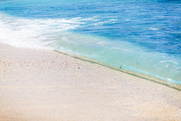 Blue ocean and sand. Tropical beach in Bali or Hawaii 