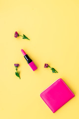 decorative cosmetics on yellow background top view