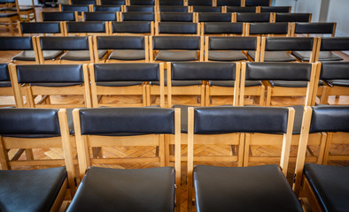 Fototapeta premium Empty chairs in the church