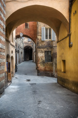 Fototapeta na wymiar Alleys on a rainy spring day in a small magical village Siena, T