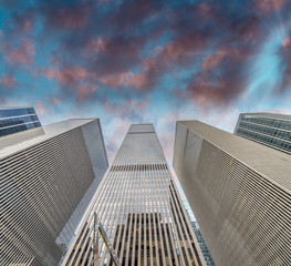 Skyward view of Manhattan skyscrapers at sunset