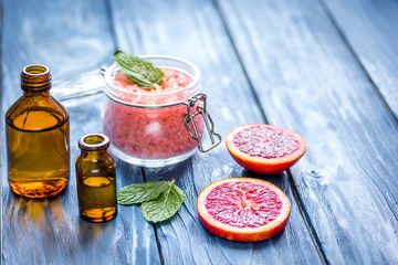 organic cosmetic with citrus on blue background