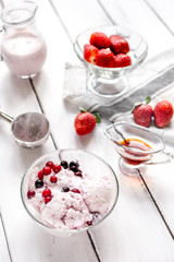 organic homemade ice cream in glass bowl on wooden background