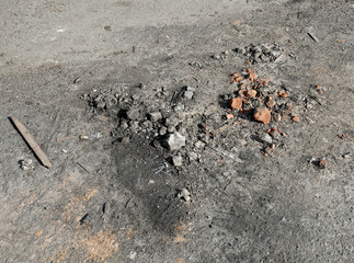 Construction waste, dirt and dust on the asphalt. 