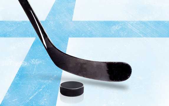 Hockey Stick and Puck With Finland Flag on Ice