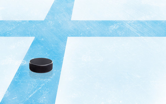 Hockey Puck and Finland Flag on Ice With Copy Space