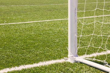 Soccer goal with grass field.