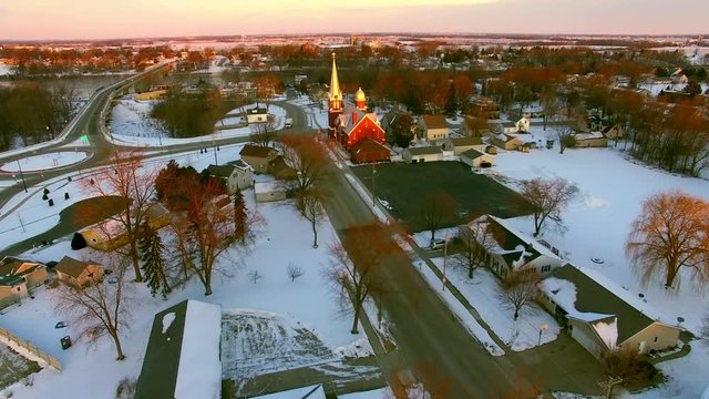 Beautiful Church steeples catch first light of Daybreak in small town America.
