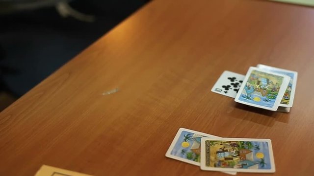 People playing cards on table