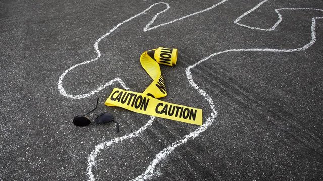 A police chalk line of a pedestrian who was hit by a car becomes a crime scene.