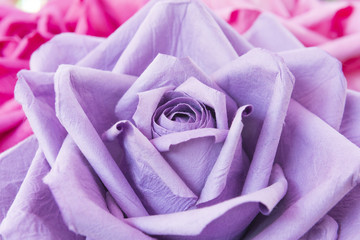 Close-up of the artificial purple rose flower.The hand made violet rose