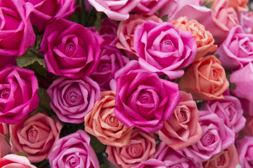Obraz na płótnie Canvas Close-up of the artificial red rose flower.The hand made paper rose flower