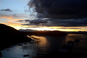 Clouds lighting up during a beautiful sunrise over lake Titicaca from Isla del Sol.