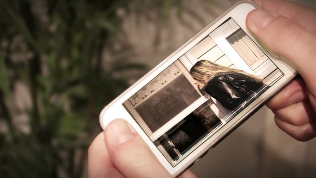 Man watching Action movie on smartphone V2