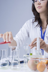 Fototapeta premium Medicine Concepts and Ideas. Female Laboratory Staff Working with Flasks