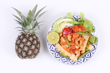 Spicy and sour vegetable salad with pineapple .