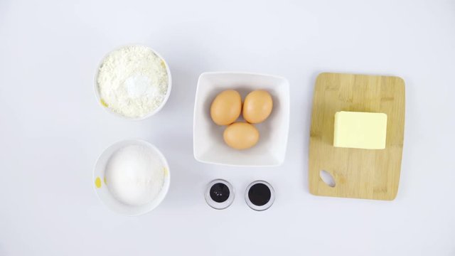 Baking ingredients on table top view slide over 4K