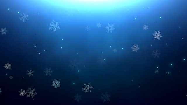 Christmas background of winter snowflakes falling slowly down a blue, festive gradient.