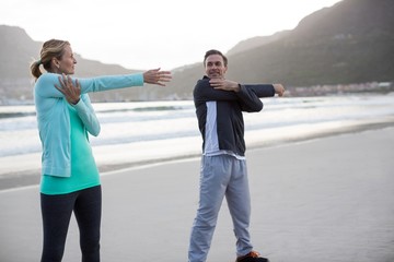 Fototapeta premium Mature couple doing stretching exercise