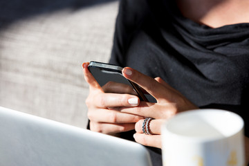Smartphone in woman hands