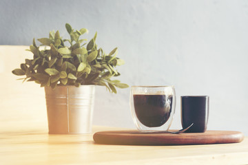 Cup of coffee on wood plate