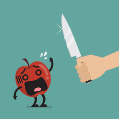 Hand with a knife prepare to cut the funny apple