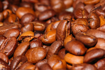 The Roasted coffee beans close-up color. Background